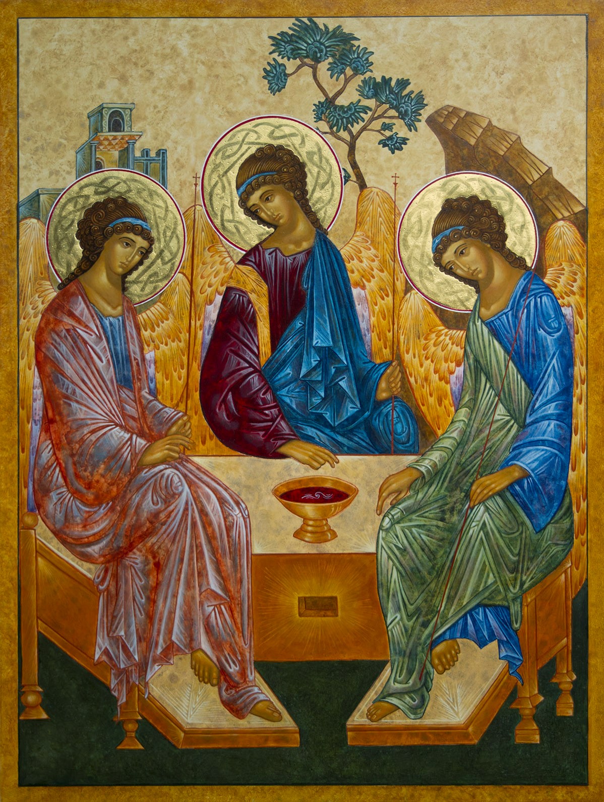 Rublev's classic icon of the trinity as three people sitting at a table.